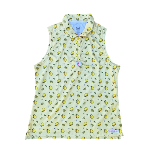 A lemon print sleeveless women’s golf polo displayed on a white background.